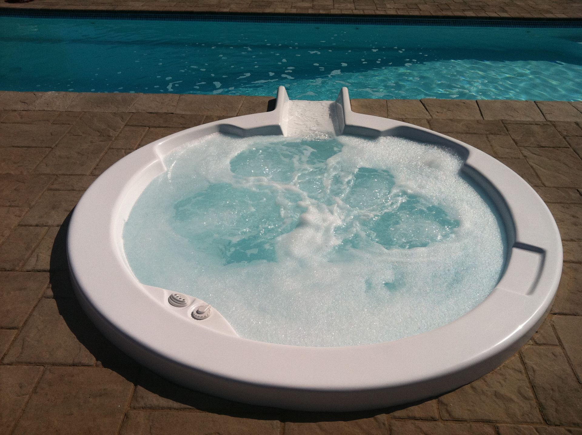 White Hot Tub Close To A Swimming Pool — Columbus, NJ — G & G Landscaping Construction, Inc.