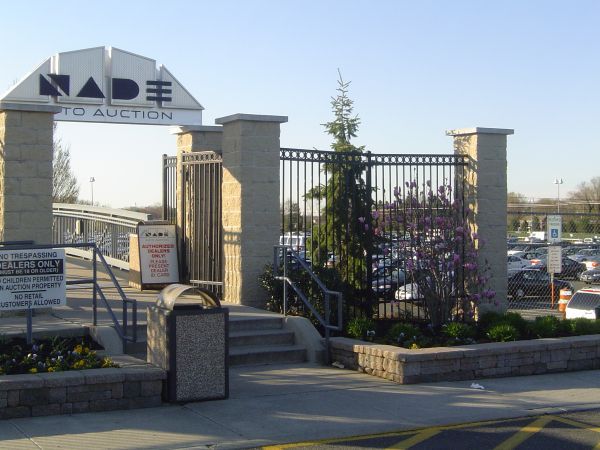 A Parking Lot With A Sign — Columbus, NJ — G & G Landscaping Construction, Inc.
