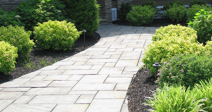 A Brick Walkway Surrounded By Shrubs — Columbus, NJ — G & G Landscaping Construction, Inc. A Brick Walkway Surrounded By Shrubs — Columbus, NJ — G & G Landscaping Construction, Inc.