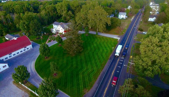 Aerial View Of A Truck Driving Down A Road — Columbus, NJ — G & G Landscaping Construction, Inc.