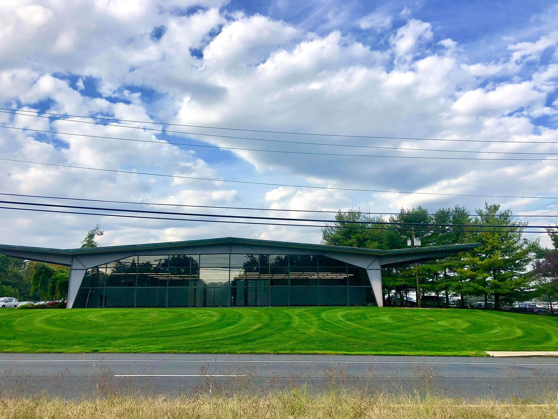 A Big Building In The Middle Of Green Field — Columbus, NJ — G & G Landscaping Construction, Inc.