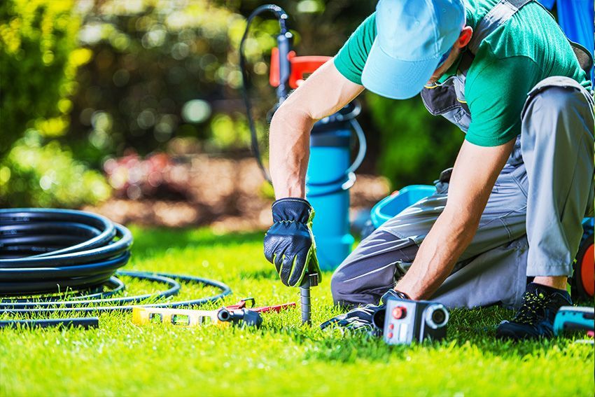 Man Repairing The Sprinkler System — Columbus, NJ — G & G Landscaping Construction, Inc.
