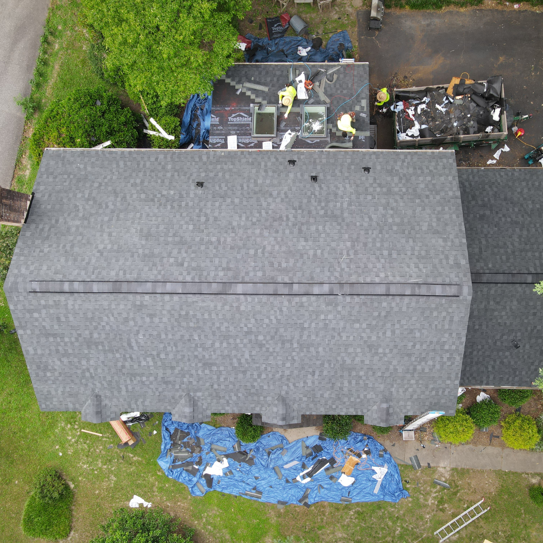 A drone image of a RETEX roof replacement in North Chesterfield VA 23235. Image shows shingle installation on sunroom step.
