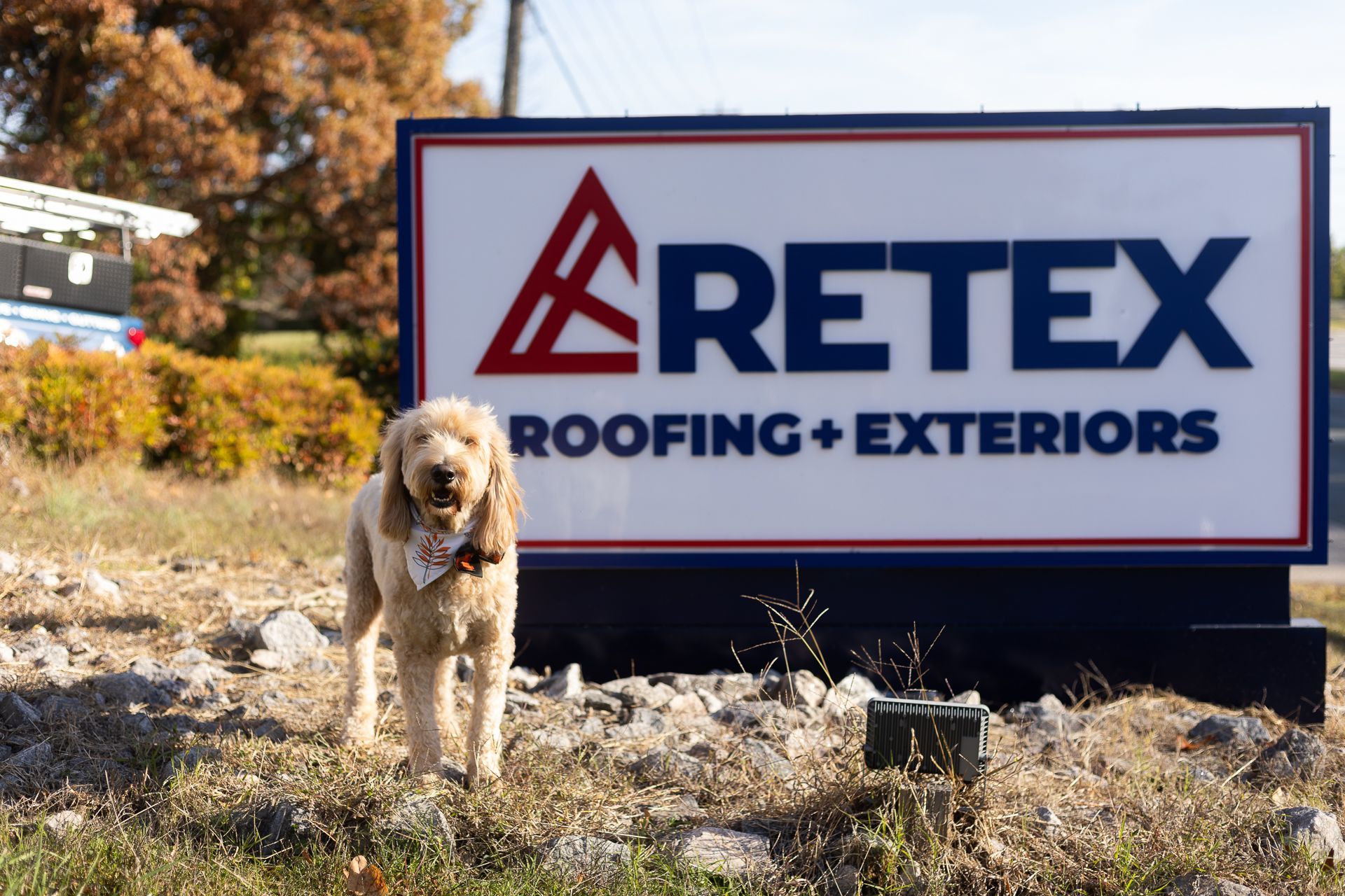 Photo of RETEX's Albus Lewis in front of a Christmas tree during the holiday season.