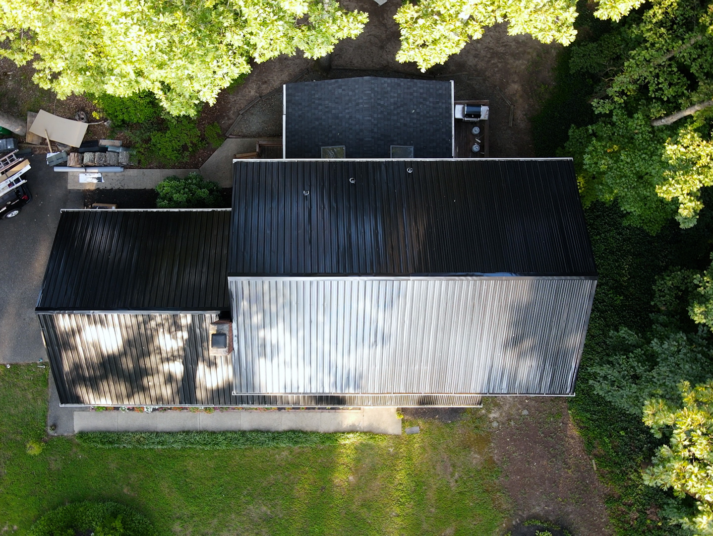 Aerial drone image of RETEX black ribbed metal roof installation in North Chesterfield VA 23235.