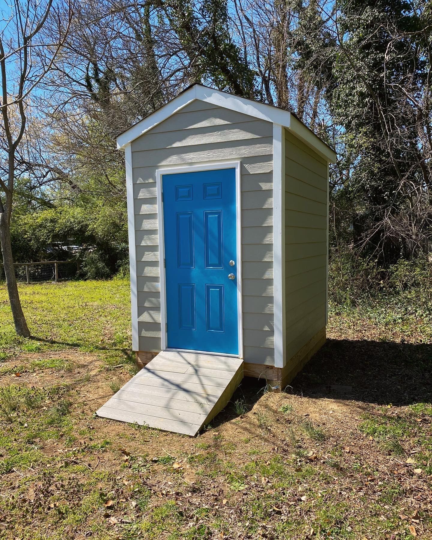 Photo from a Richmond Habitat for Humanity home dedication in March 2023. RETEX helped install this shed's siding.