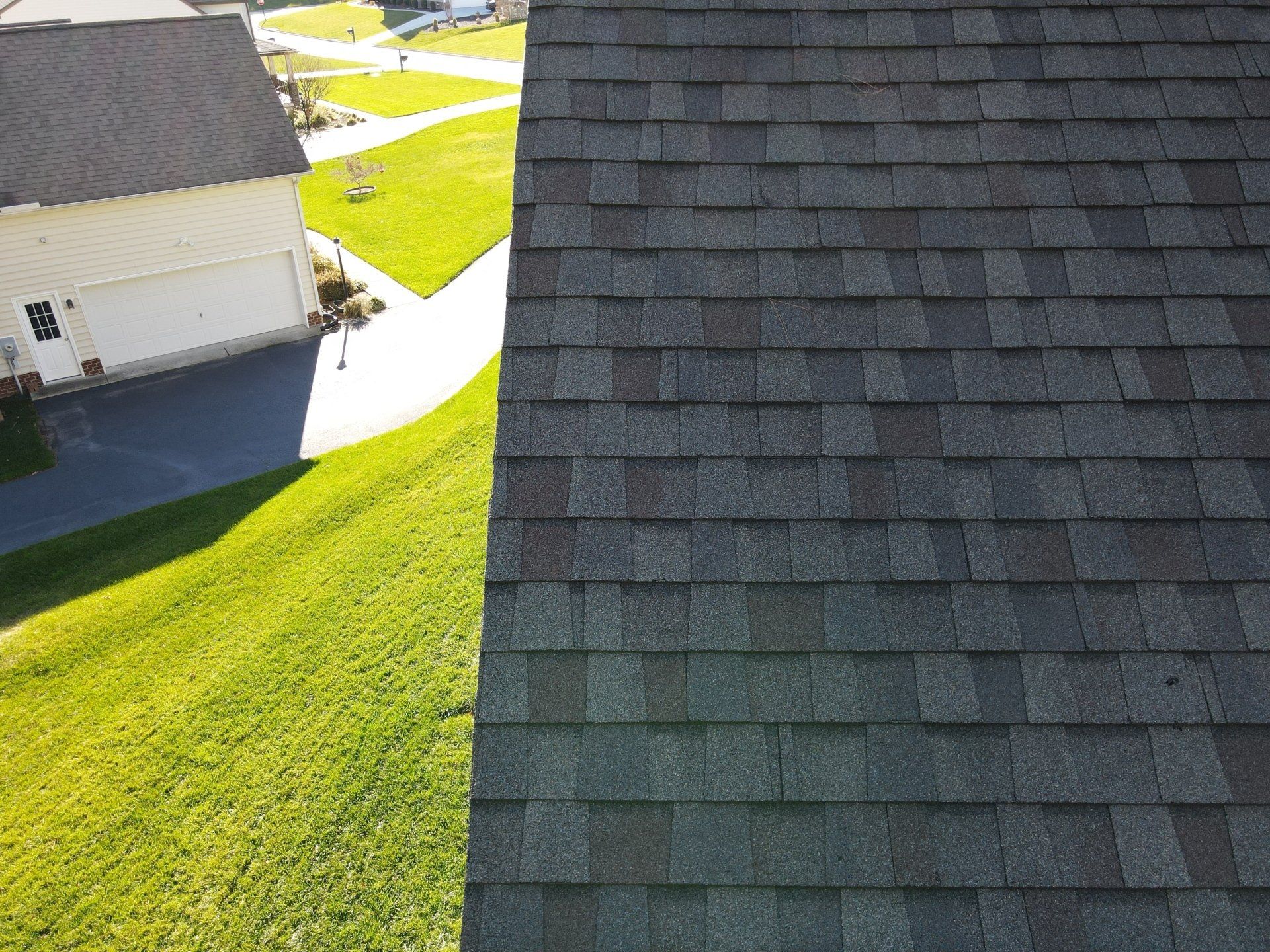 Drone image of roof line, asphalt shingle roof.