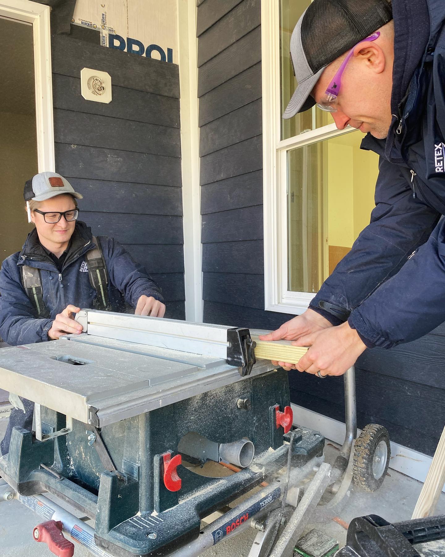 Image of RETEX’s Caleb Hennon and Josh Lewis volunteering with Richmond Habitat for Humanity in December 2022.