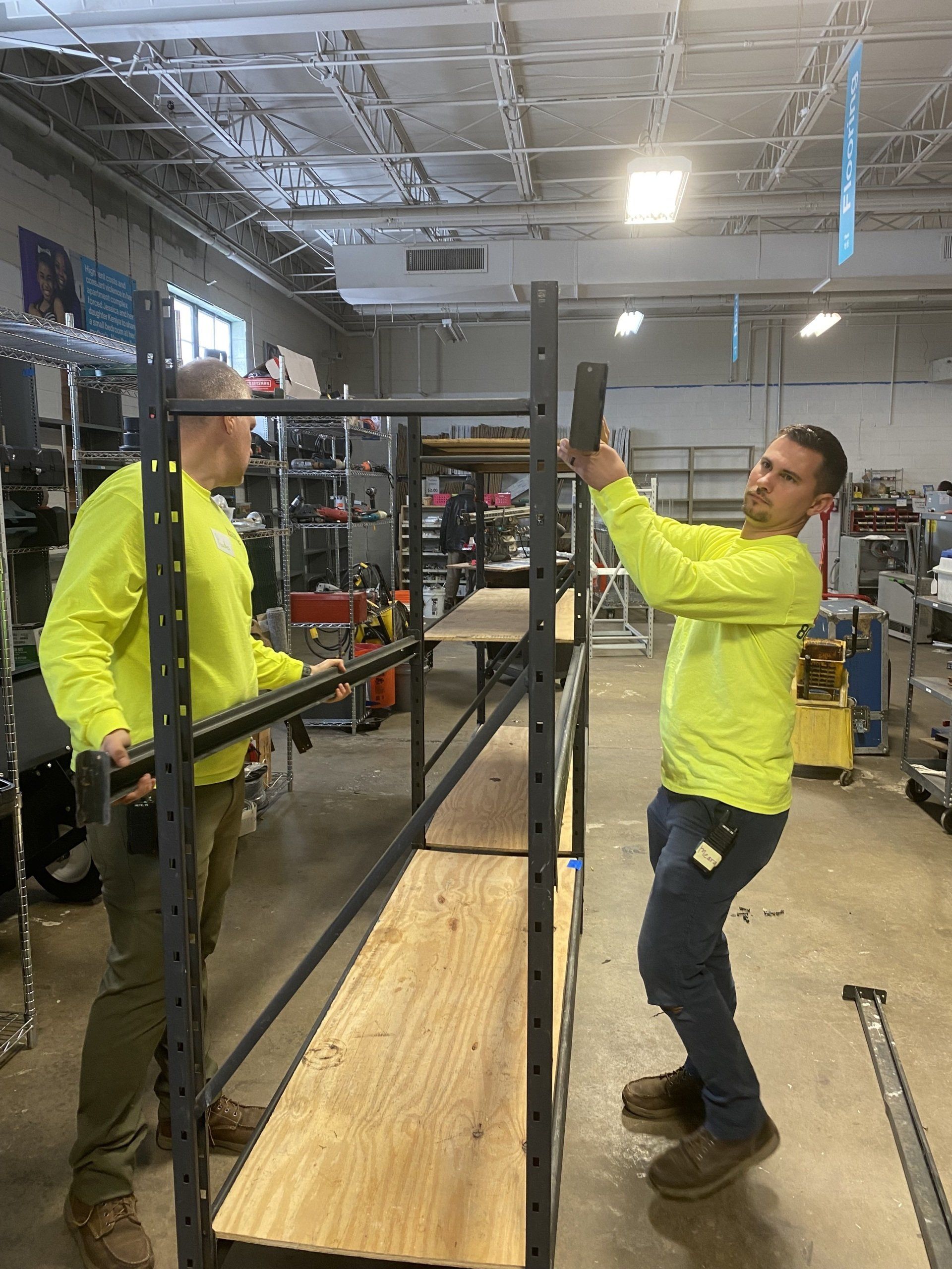 Image of RETEX's Mark Erickson and Caleb Kammerling volunteering at Habitat for Humanity's Midlothian ReStore.