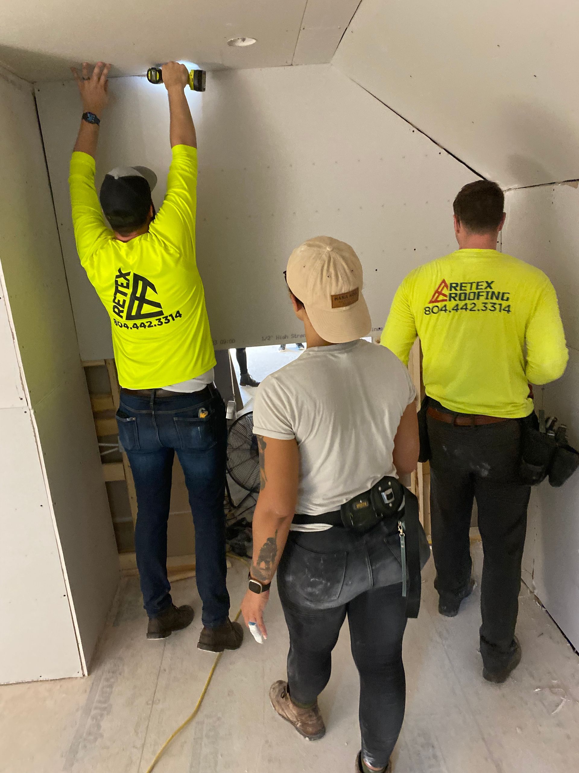 Image of RETEX's John Gordon and Josh Lewis volunteering at Richmond Habitat for Humanity in June 2023.retex team