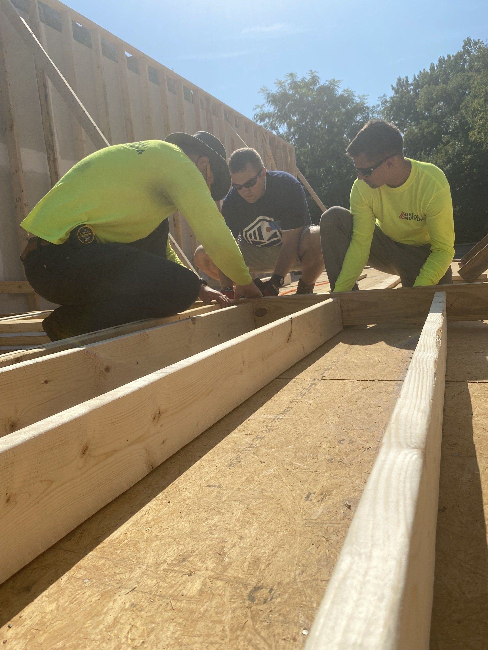 Image of RETEX's Josh Lewis and Caleb Kammerling building out framing for a Richmond Habitat for Humanity home.