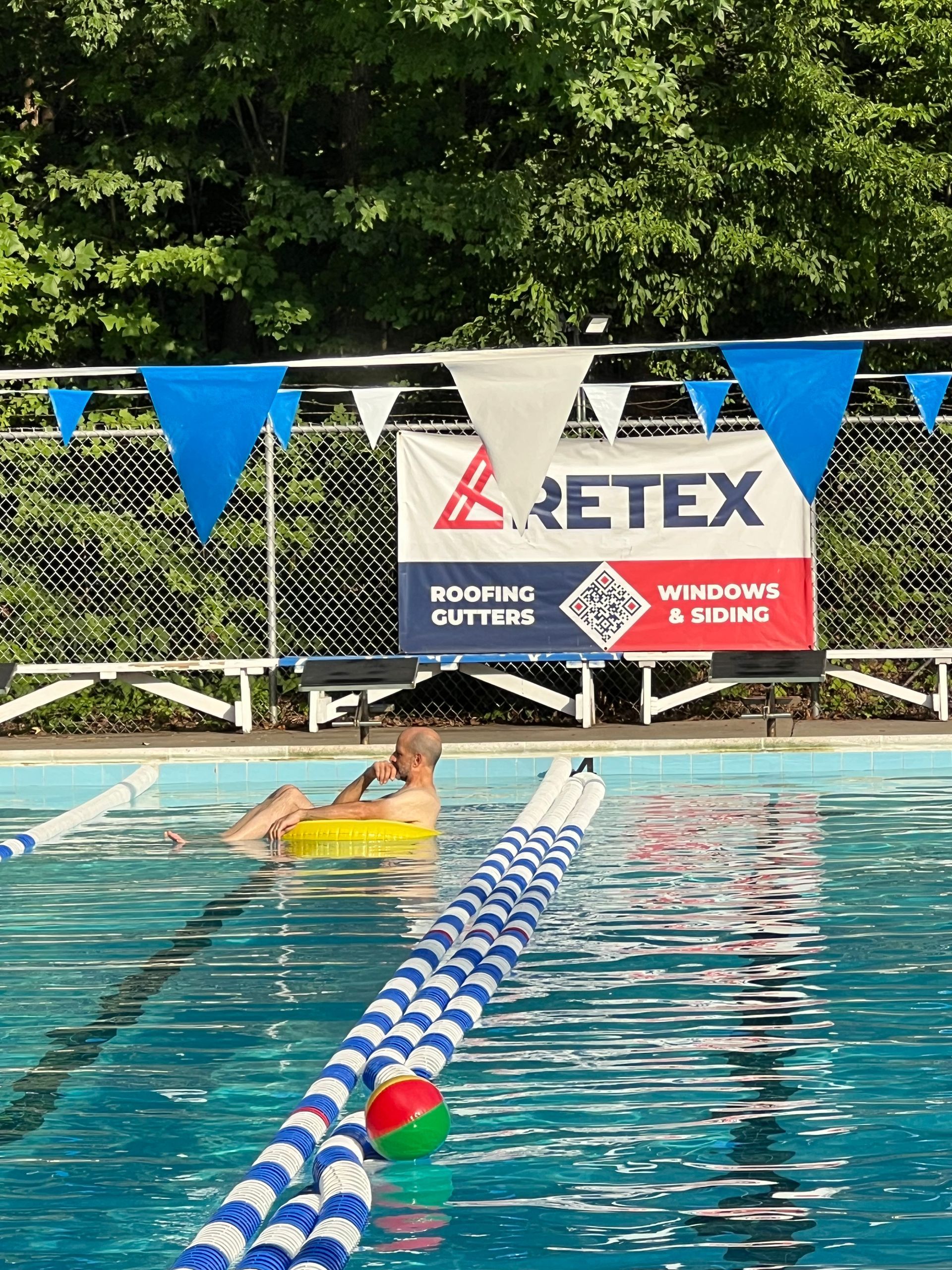 Photo of RETEX’s Mark Scarpino relaxing in a pool tube during our 2025 RETEX team pool party.