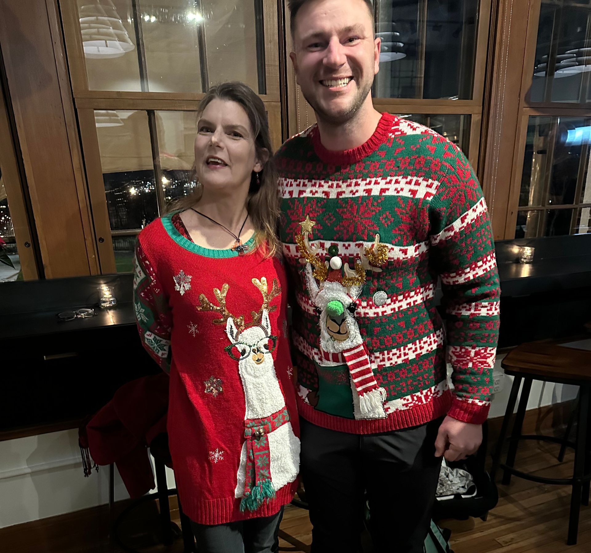Image of RETEX 's Josh Lewis and a RETEX spouse during team holiday dinner in December 2023.