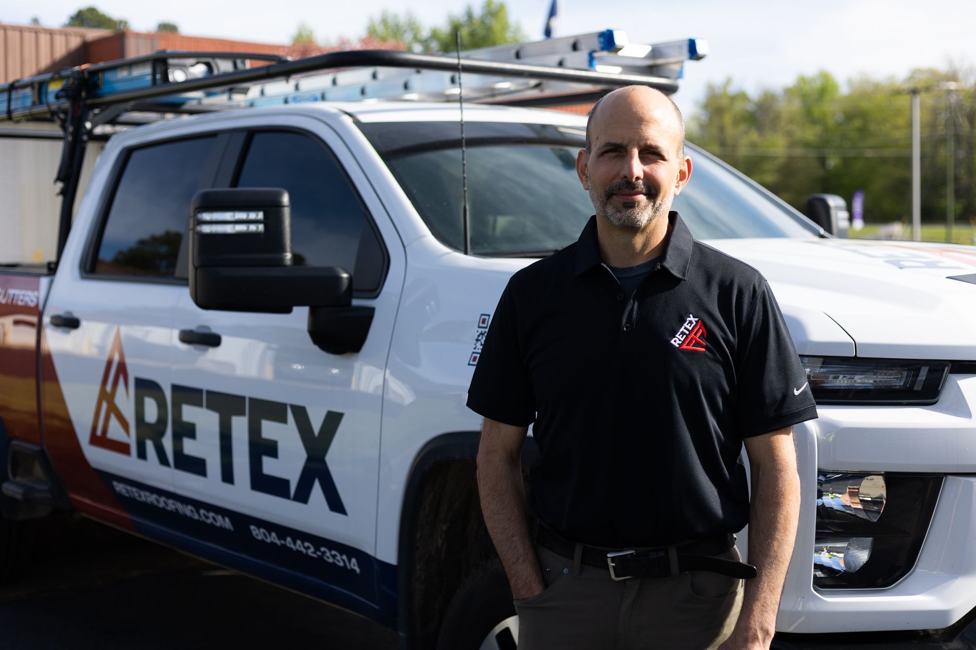Richmond project manager Mark Scarpino stands in front of his RETEX truck.