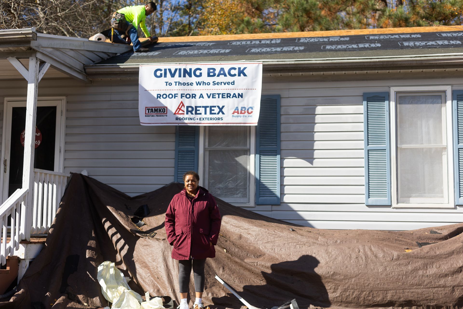 Mrs. Carol Coleman, our Roof For A Veteran 2025 recipient, stands in front of her home.
