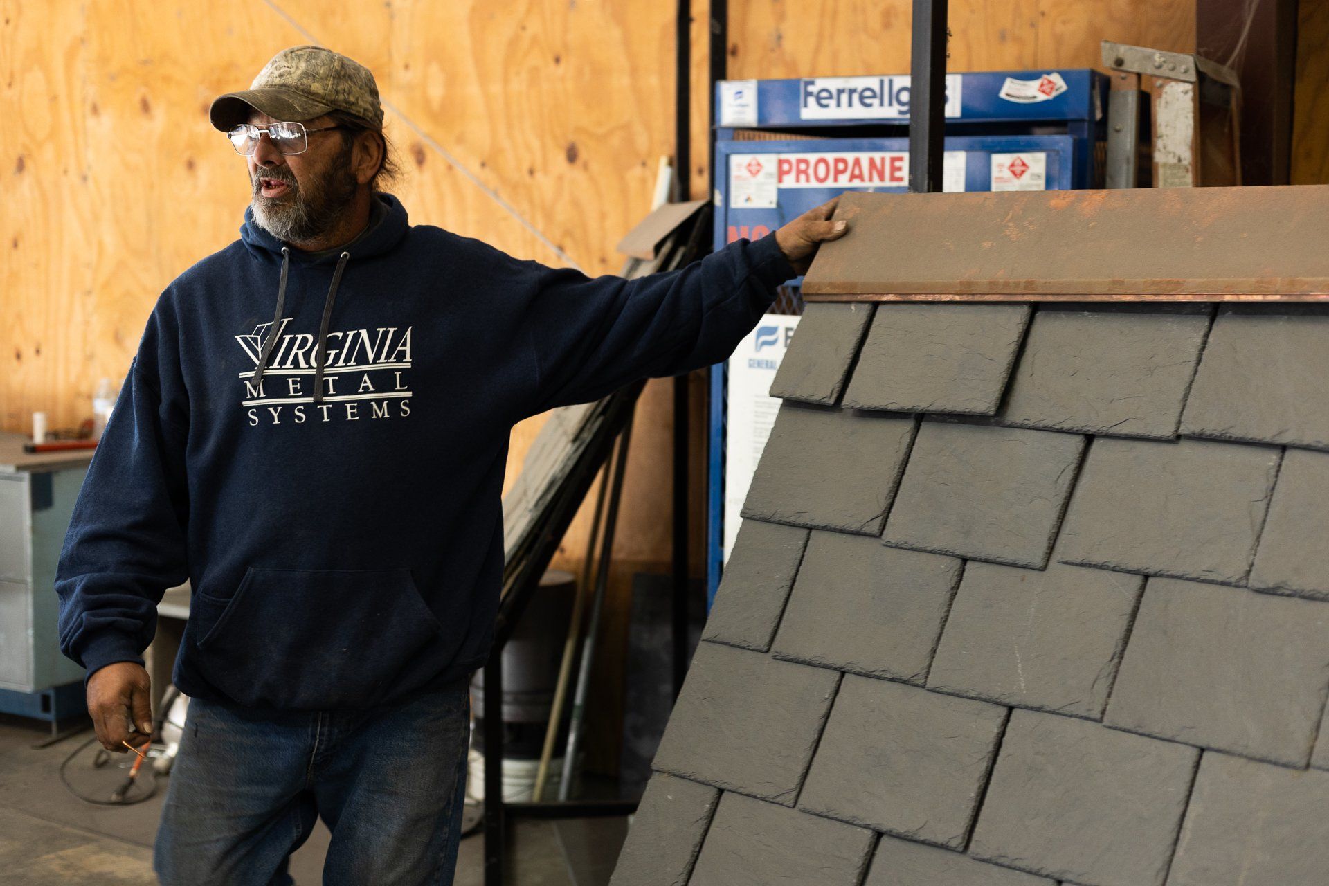 An image of a manufacturer discussing natural slate roof installation during a team training event.