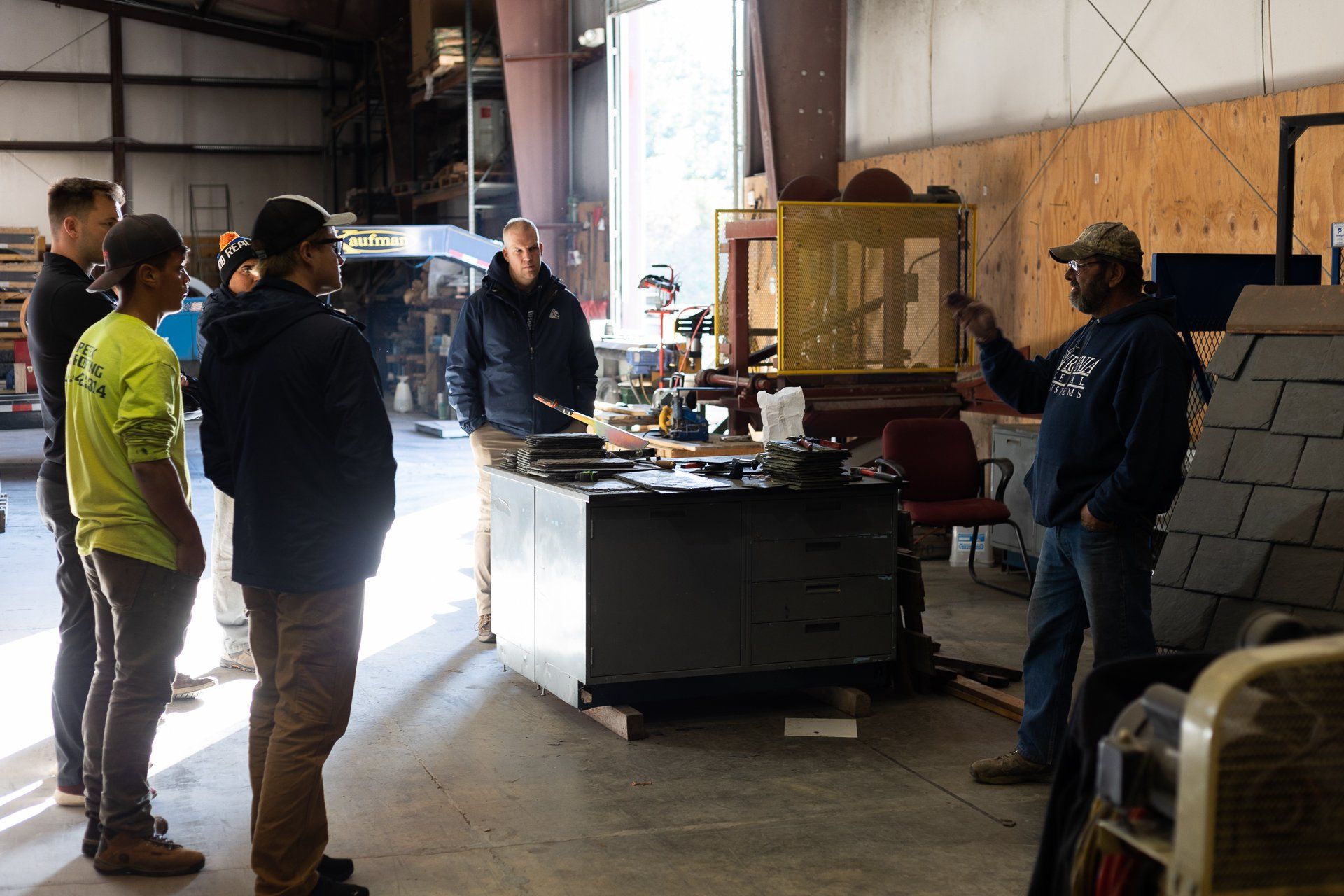 A image of the RETEX group learning about natural slate roofs during a team training event.
