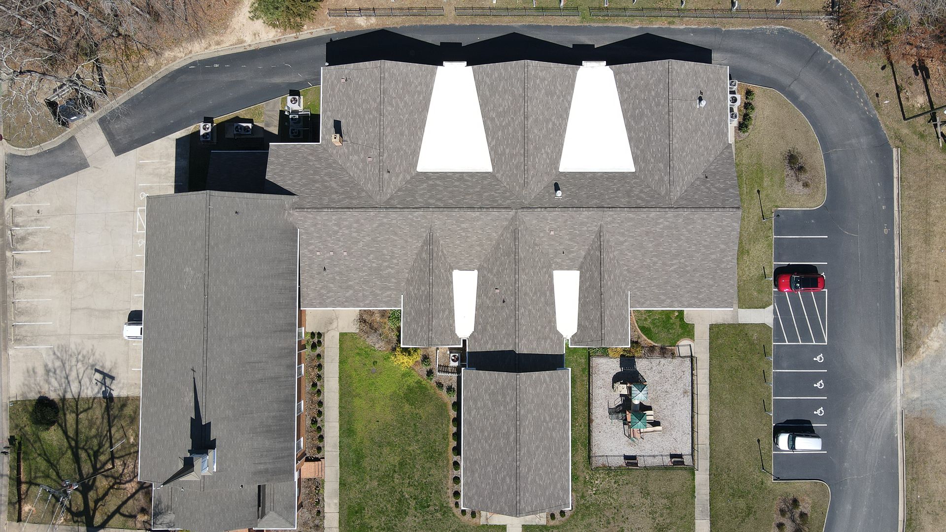 Aerial photo of RETEX-installed shingle roof and flat roofs for Tomahawk Baptist Church.