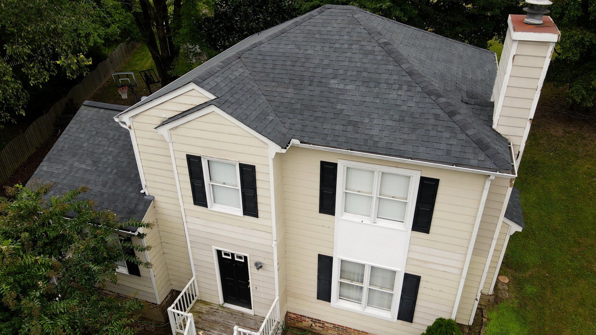 Image of RETEX roof replacement in Midlothian VA 23112.  Tamko Heritage Rustic Black architectural asphalt shingles.