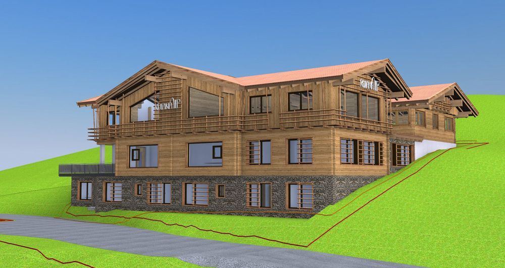 Auf einem grasbewachsenen Hügel steht ein großes Holzhaus.