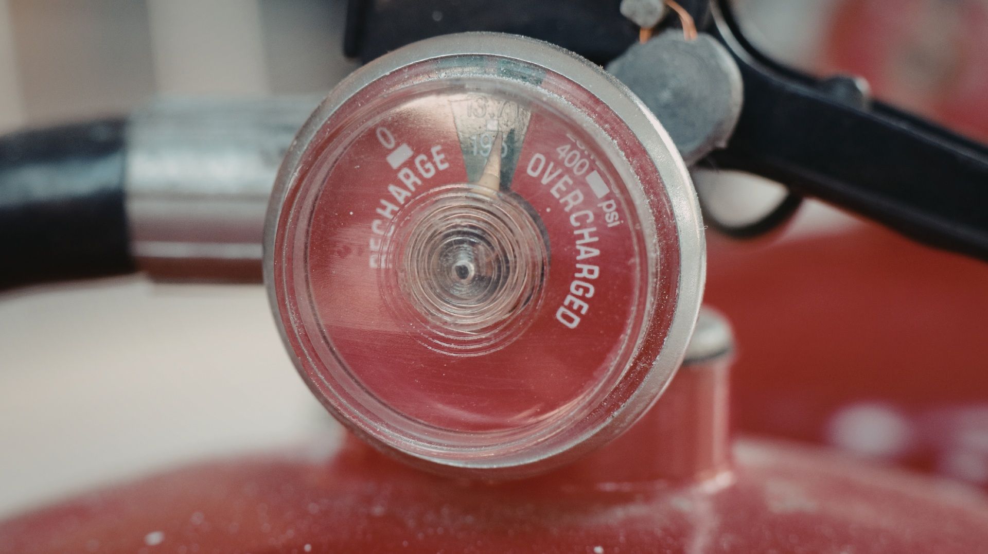 Fire extinguisher pressure gauge, needle indicating 