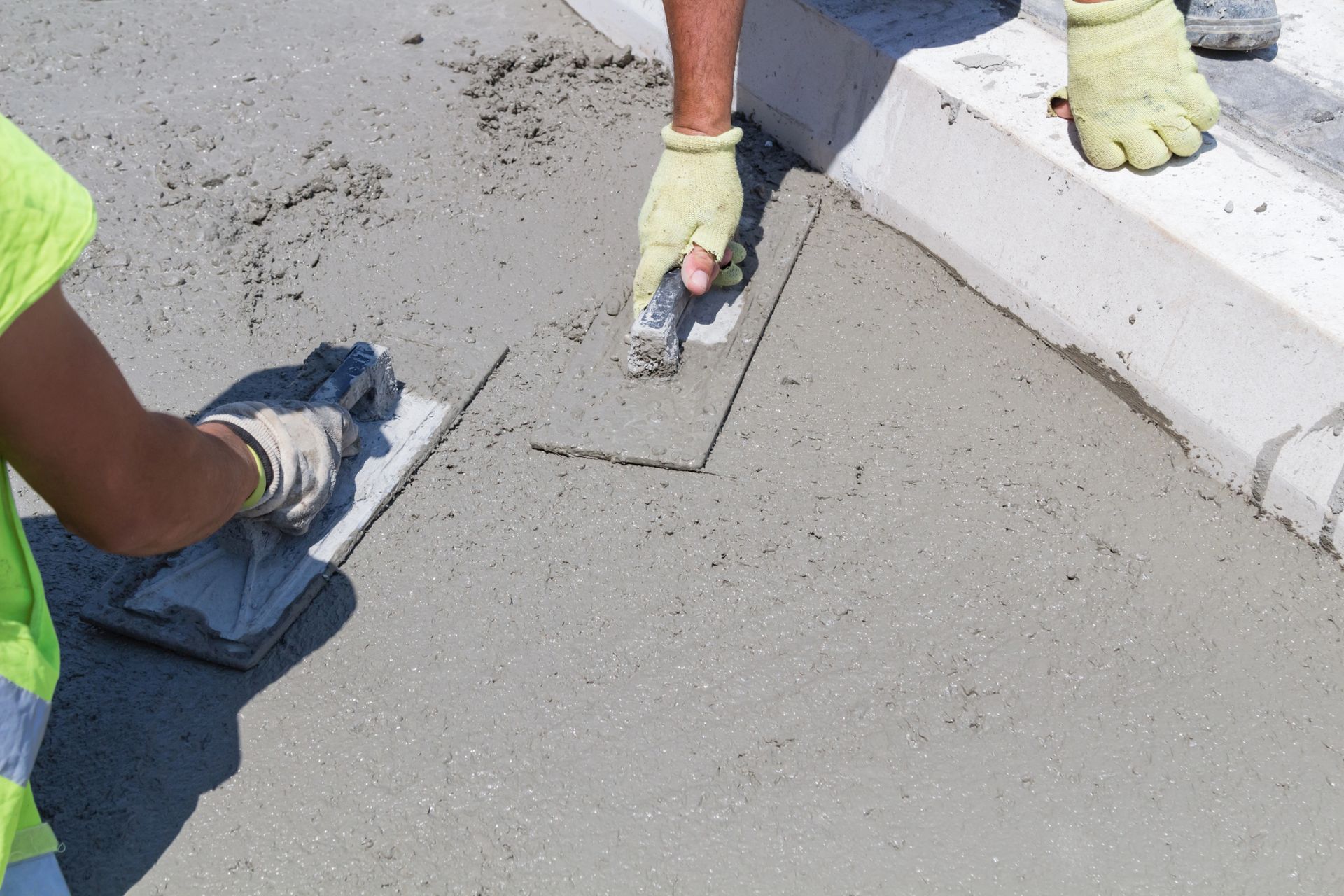 finishing of fresh concrete paving install with trowel