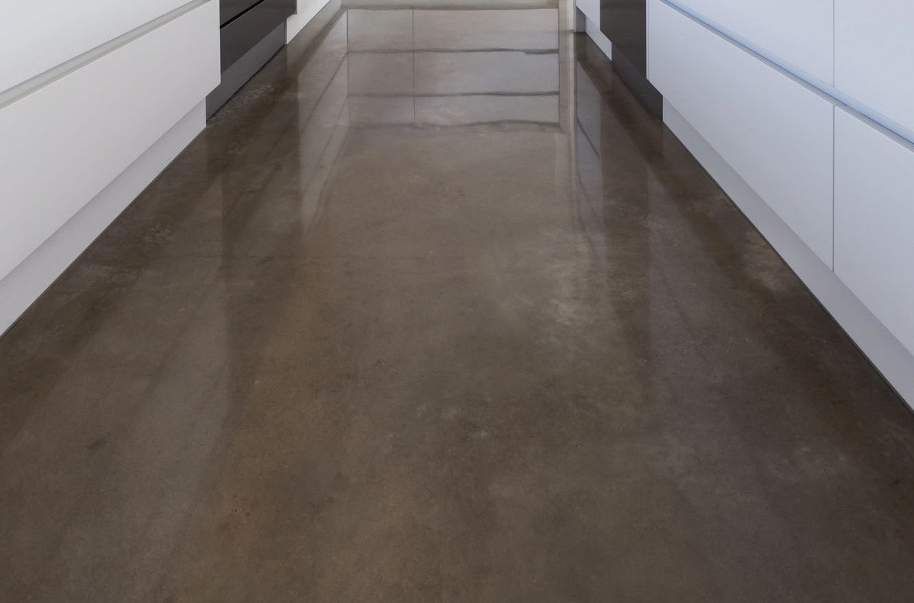 polished concrete floor in kitchen of residential home