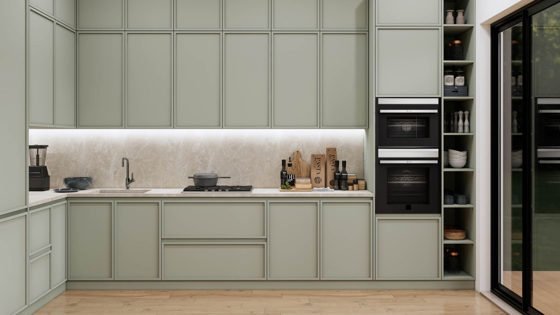 A kitchen with green cabinets , a sink , an oven , and a sliding glass door.