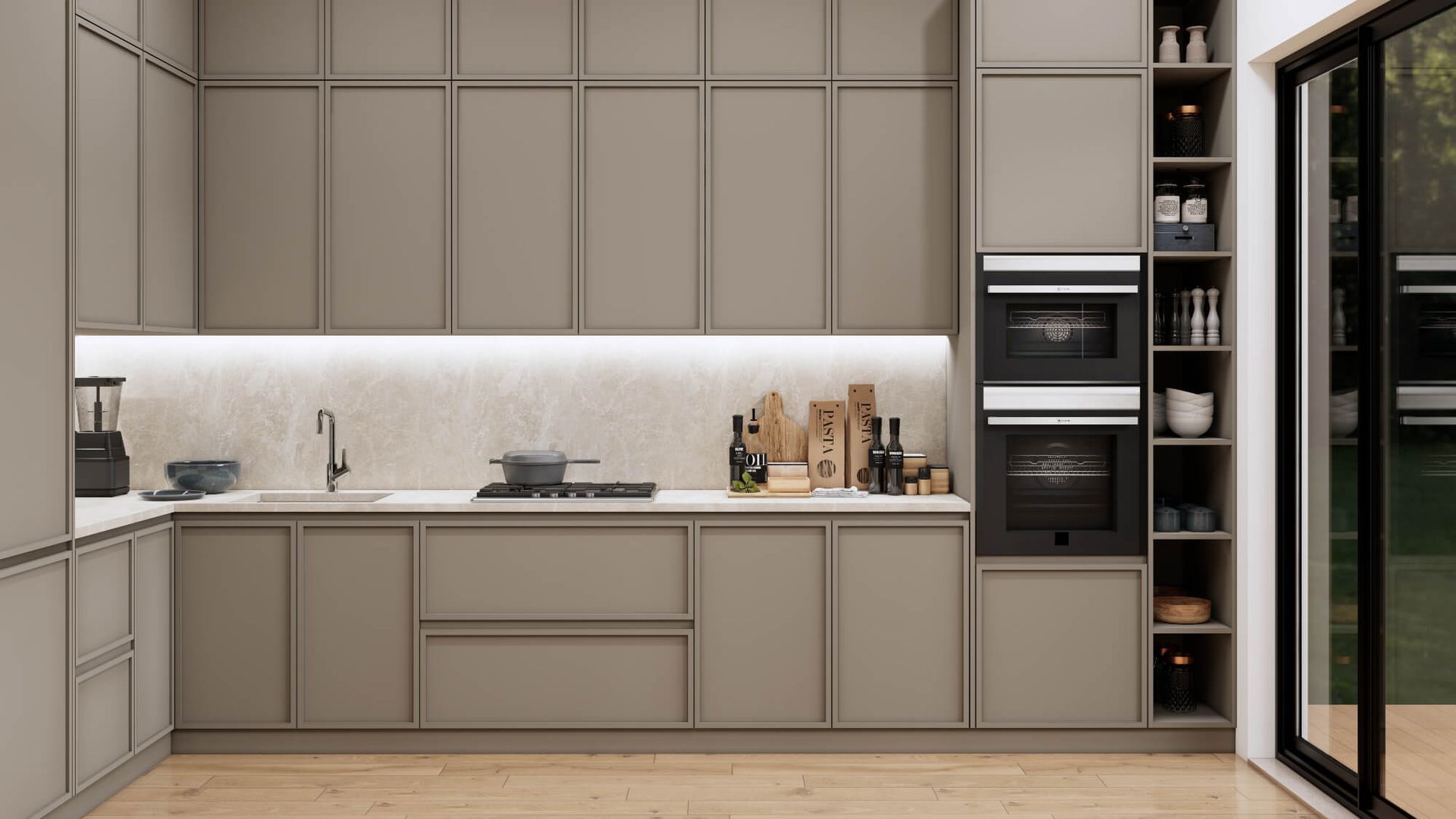 A kitchen with a sink , oven , microwave and sliding glass doors.