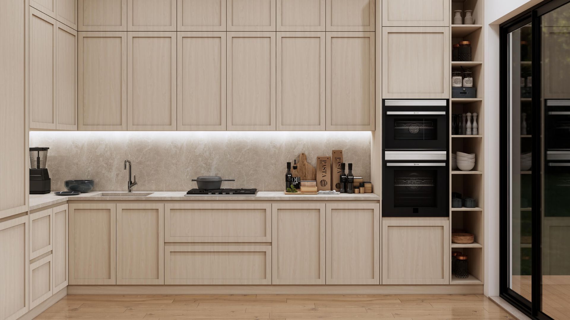 A kitchen with a sink , oven , microwave and sliding glass doors.