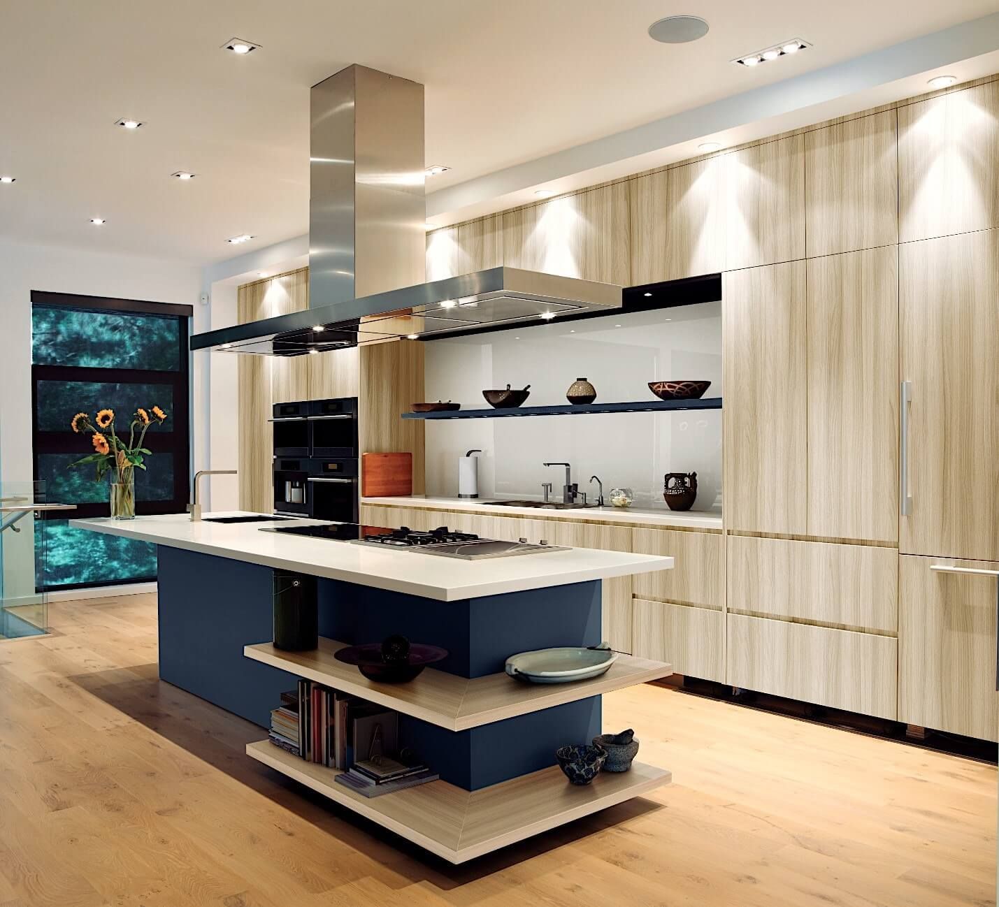 A kitchen with a large island in the middle