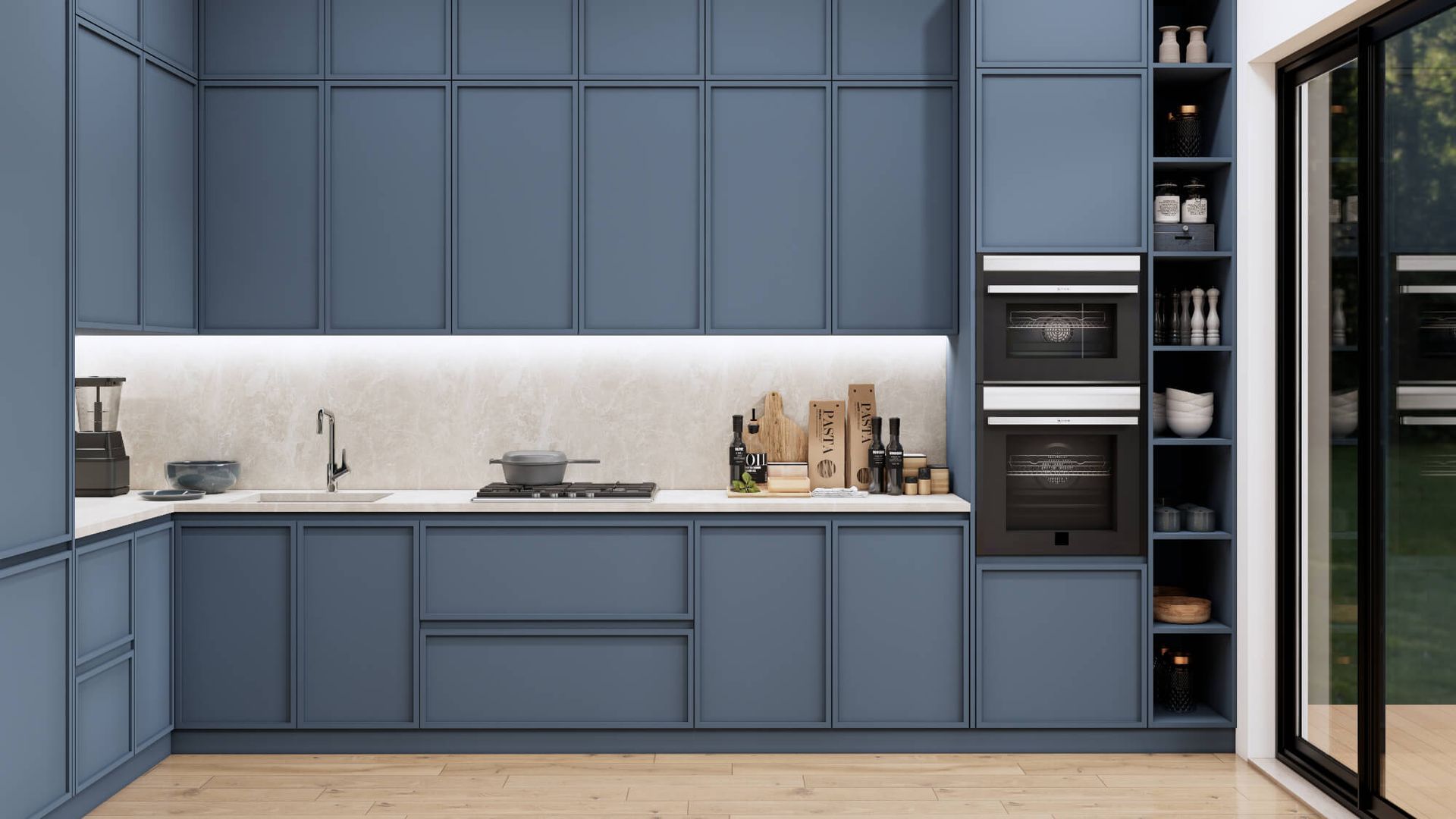 A kitchen with blue cabinets and a sliding glass door.
