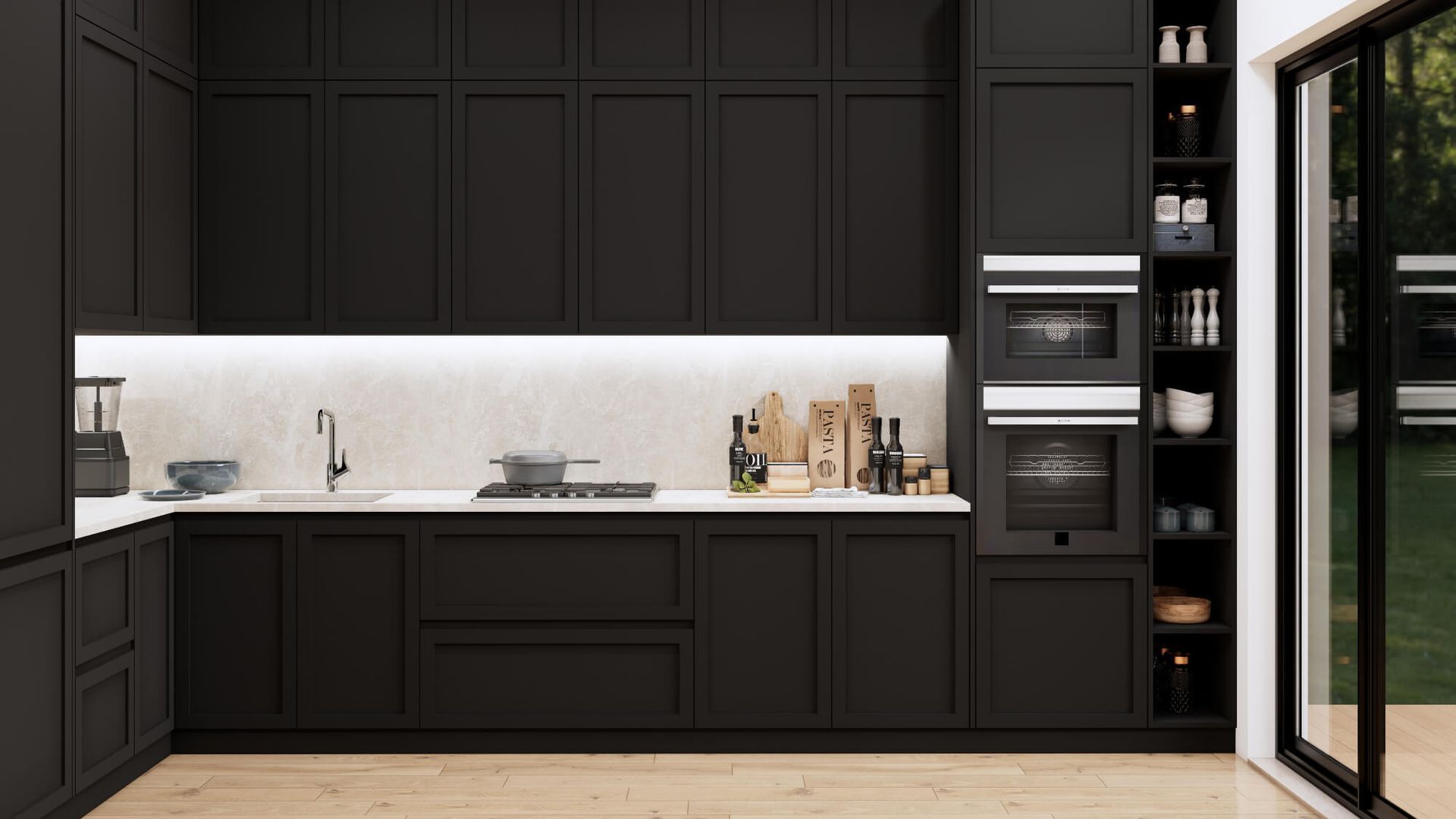 A kitchen with black cabinets , white counter tops , and a sliding glass door.