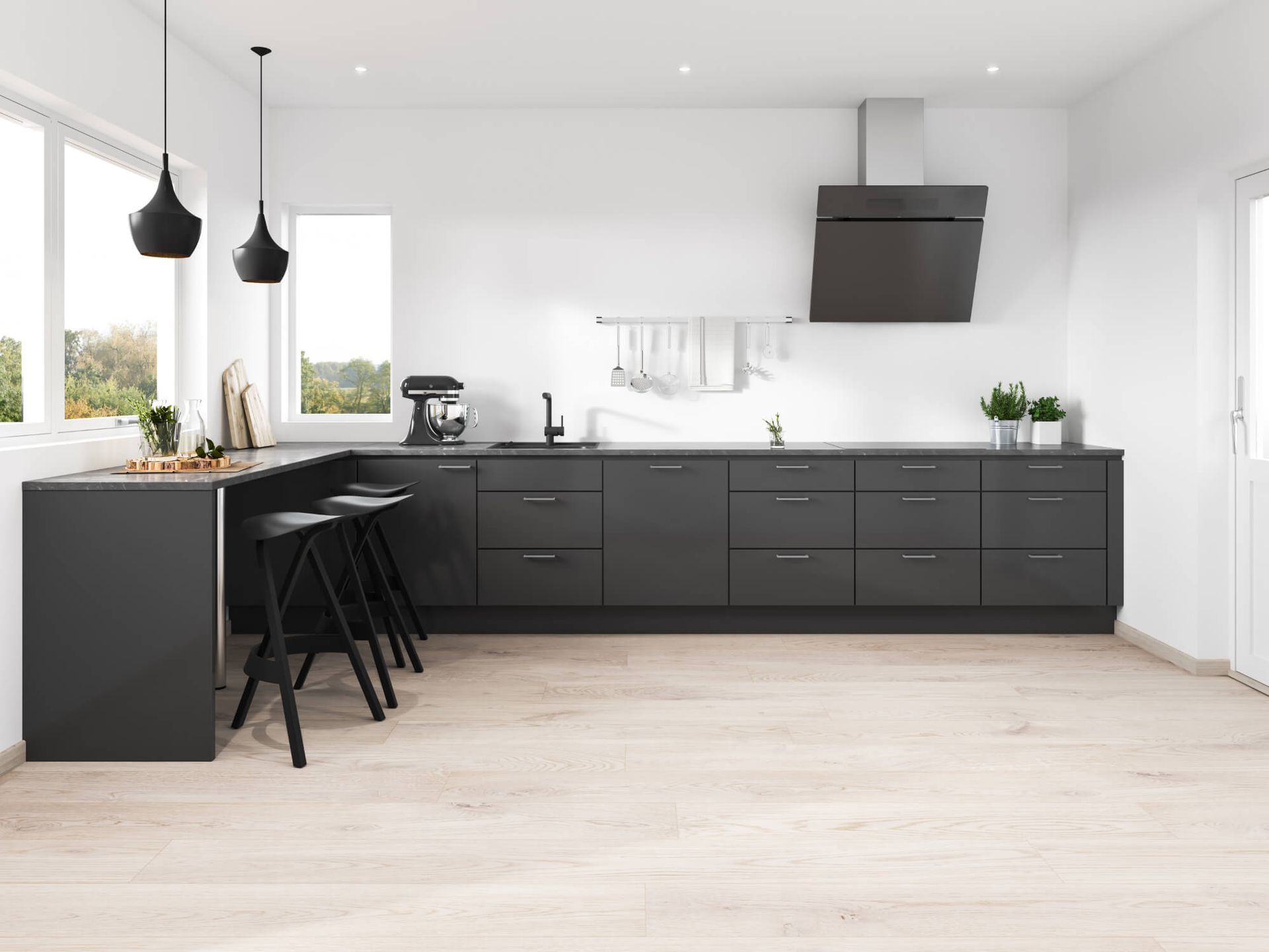 A modern kitchen with black cabinets and white walls.