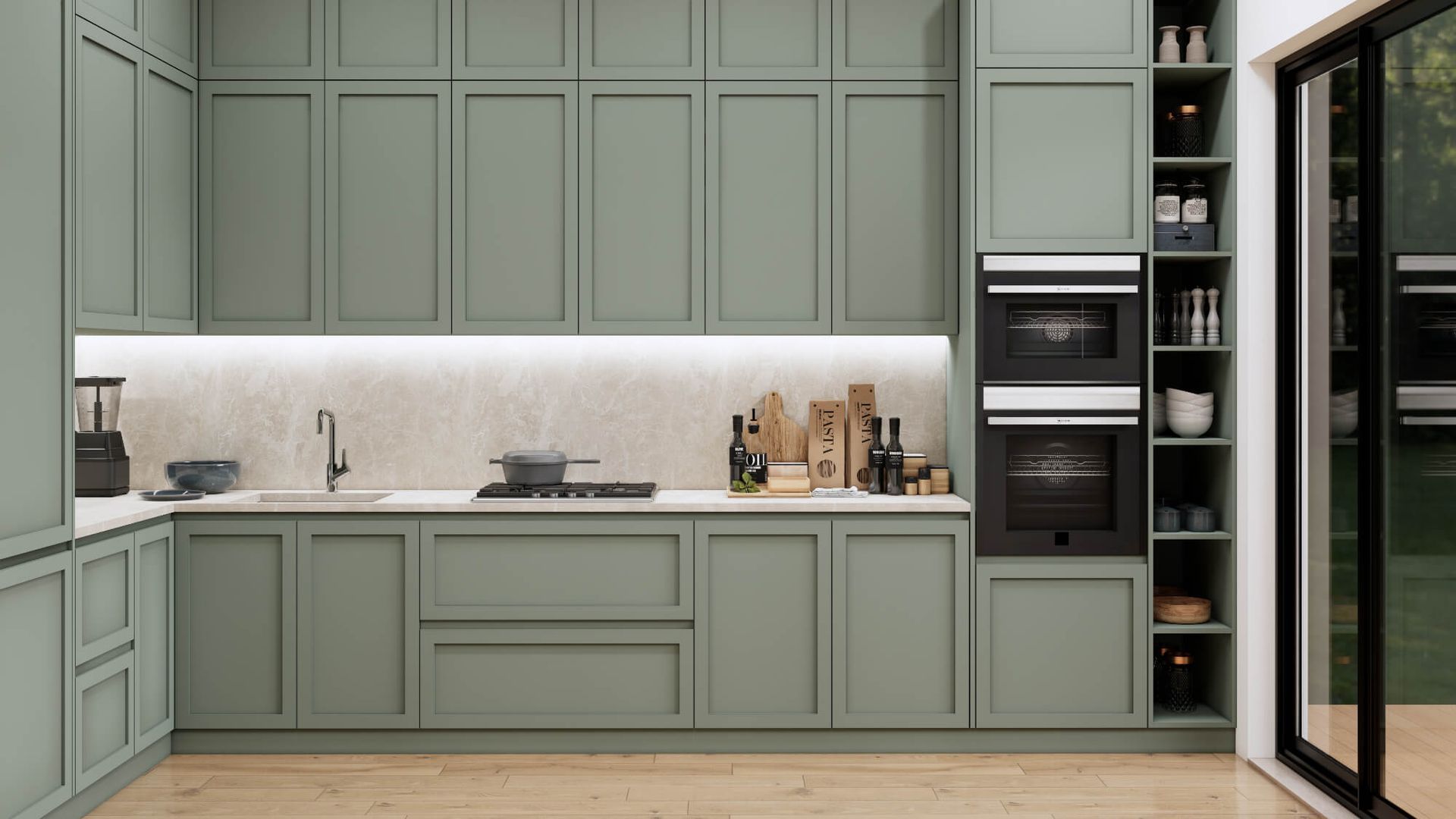 A kitchen with green cabinets , a sink , and a stove.