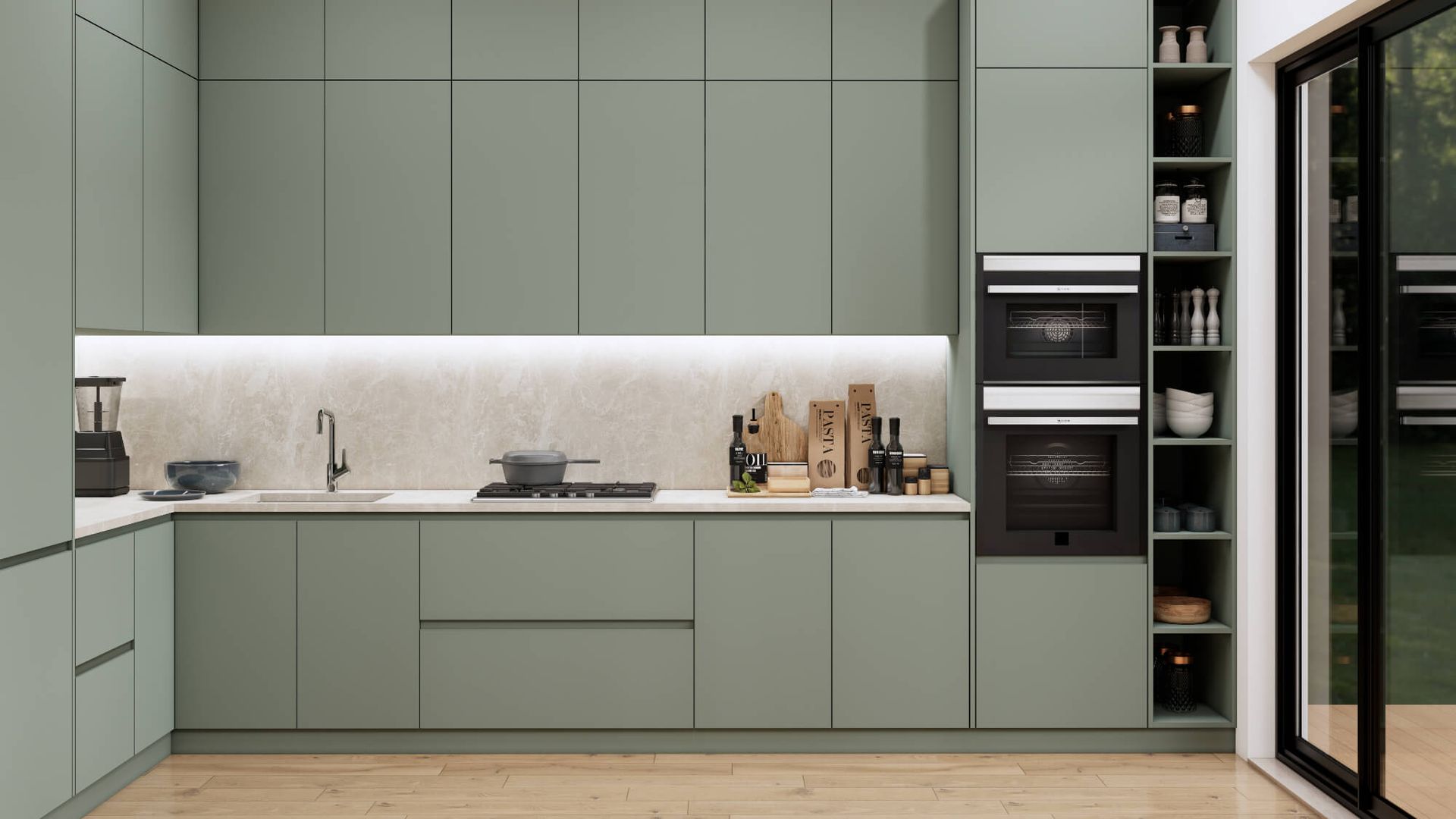 A kitchen with green cabinets , a sink , an oven , and a sliding glass door.