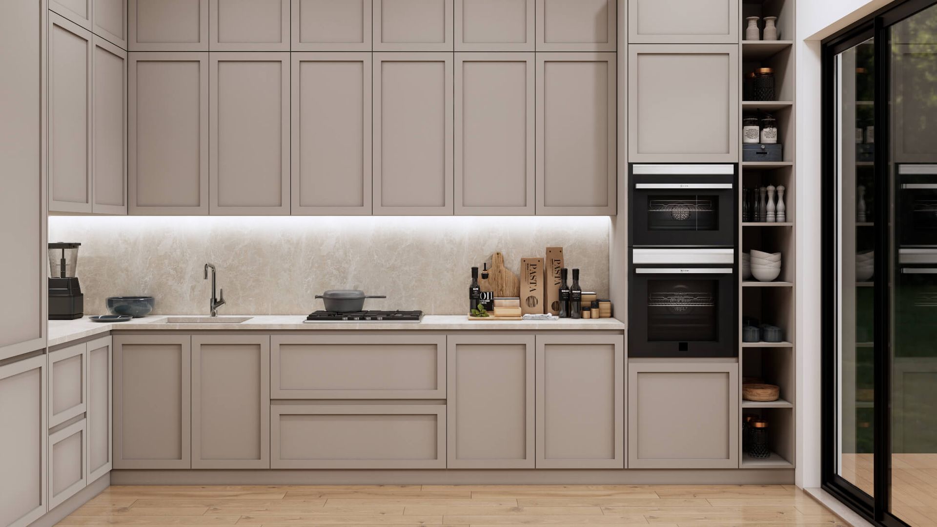 A kitchen with a sink , oven , microwave and sliding glass doors.