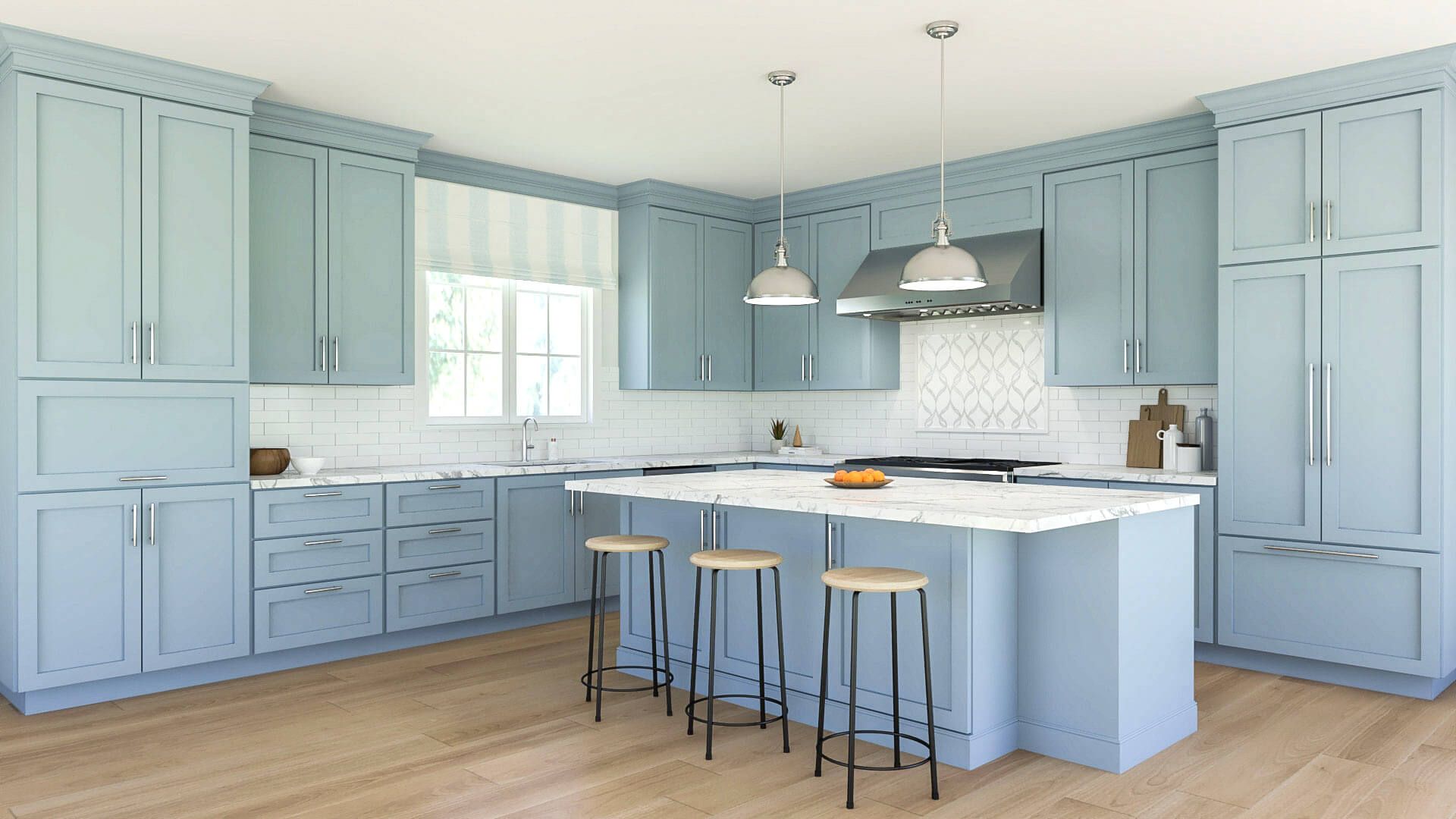 A kitchen with light blue cabinets and a large island.