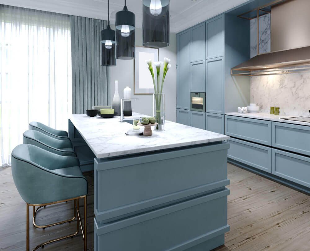 A kitchen with blue cabinets and a large island in the middle.