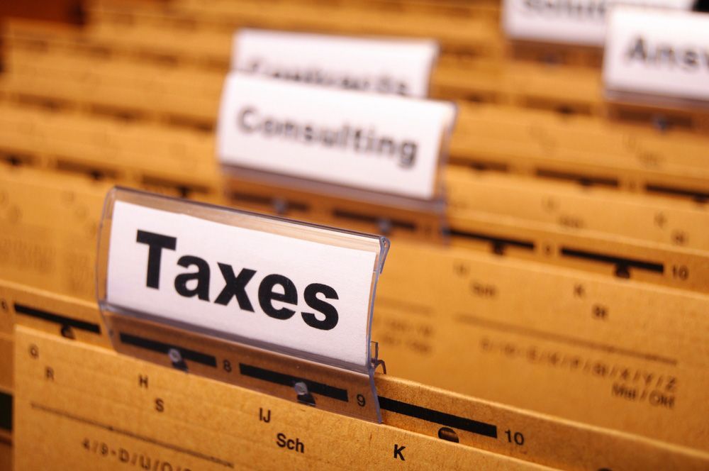 The Word Taxes Is On A Piece Of Paper — Wagga Tradesman Accounting Services In Wagga Wagga, NSW