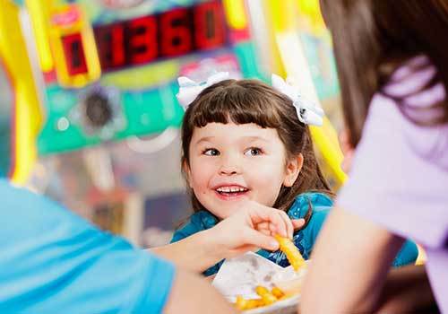 Happy family eating food — dinner in Crestview, FL