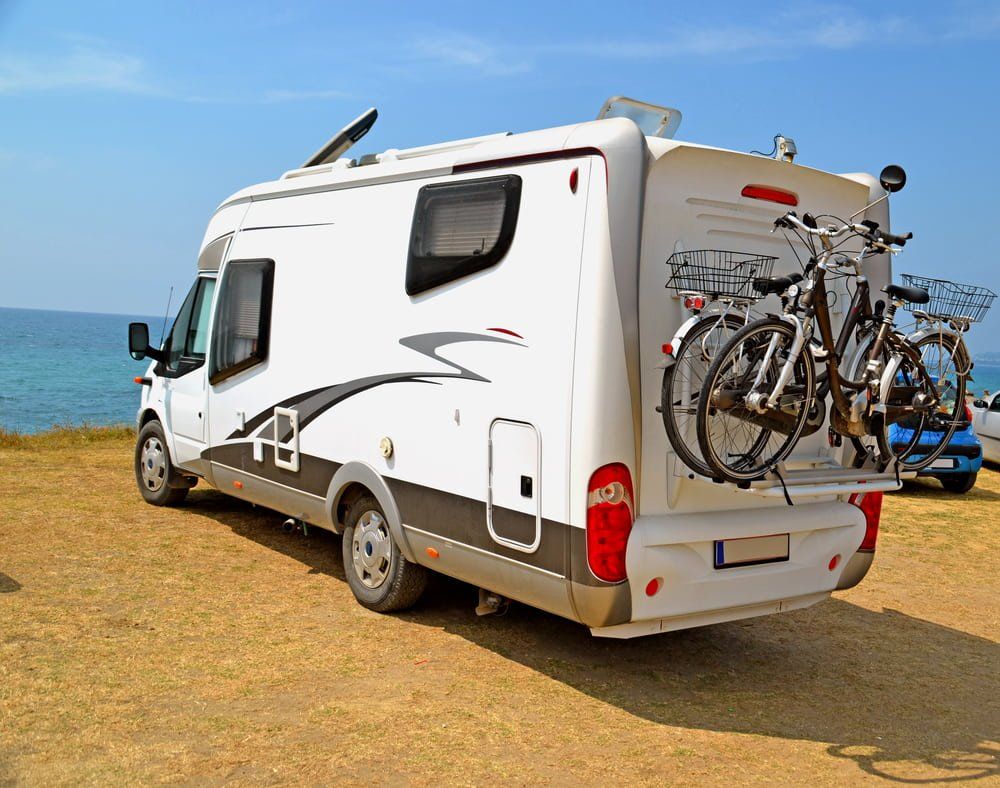 Caravan Near Ocean with Bikes on Rear — Air Conditioning in Girraween, NT