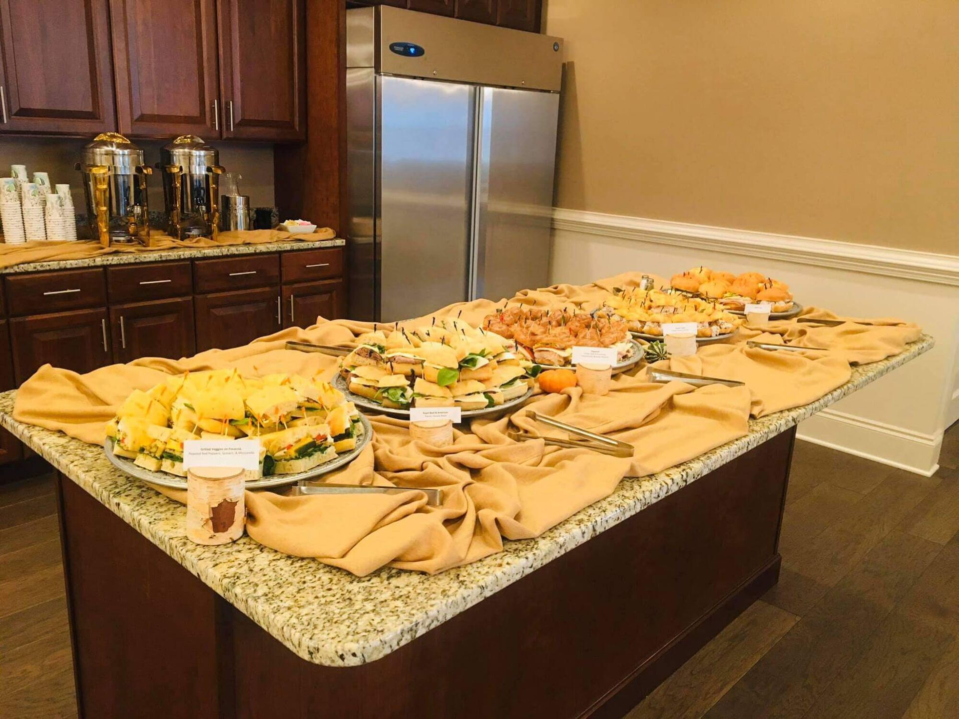 A buffet table with a lot of food on it