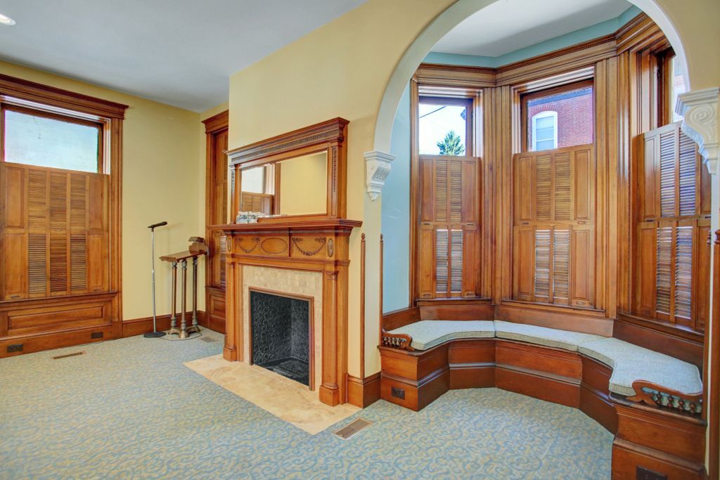 There is a fireplace in the middle of the room.