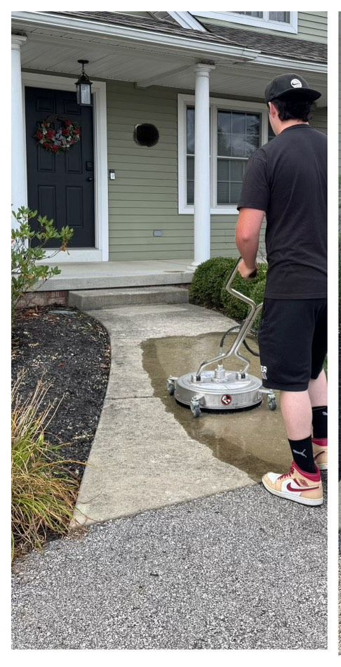 Power washing the sidewalk and concrete