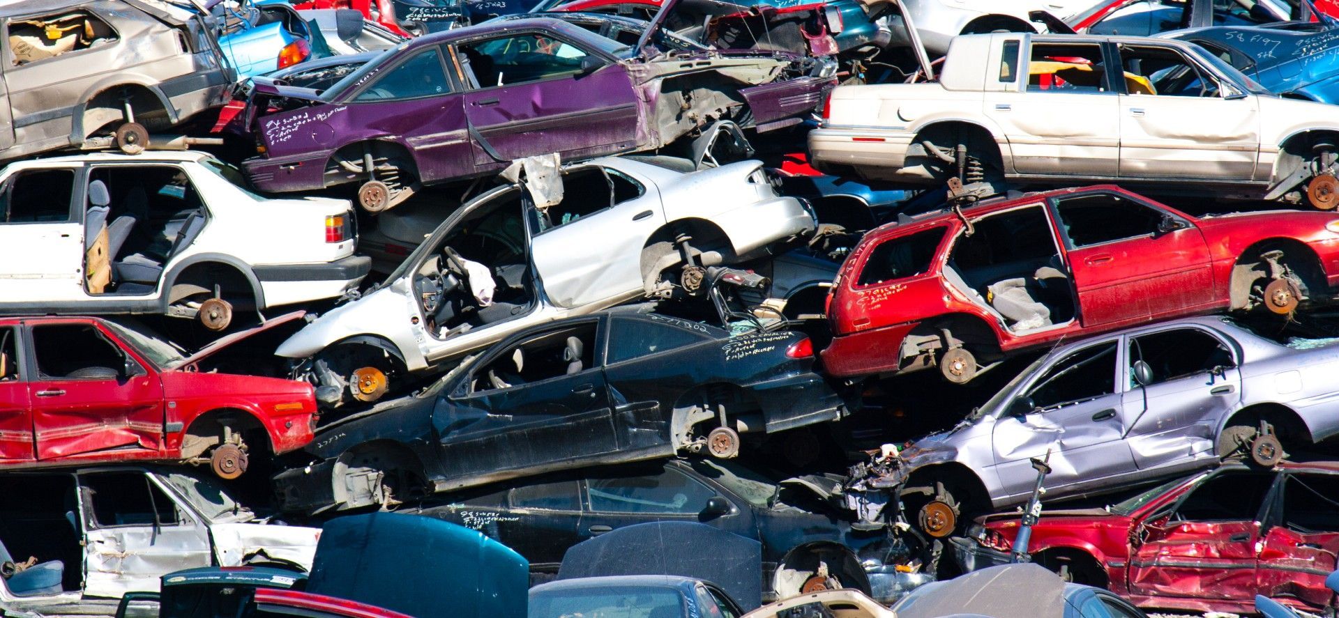 A bunch of cars are stacked on top of each other