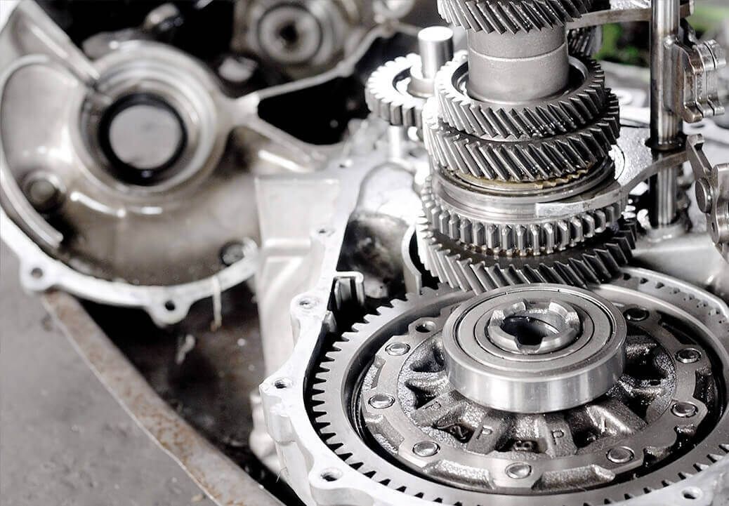 A close up of a car engine with gears and bearings