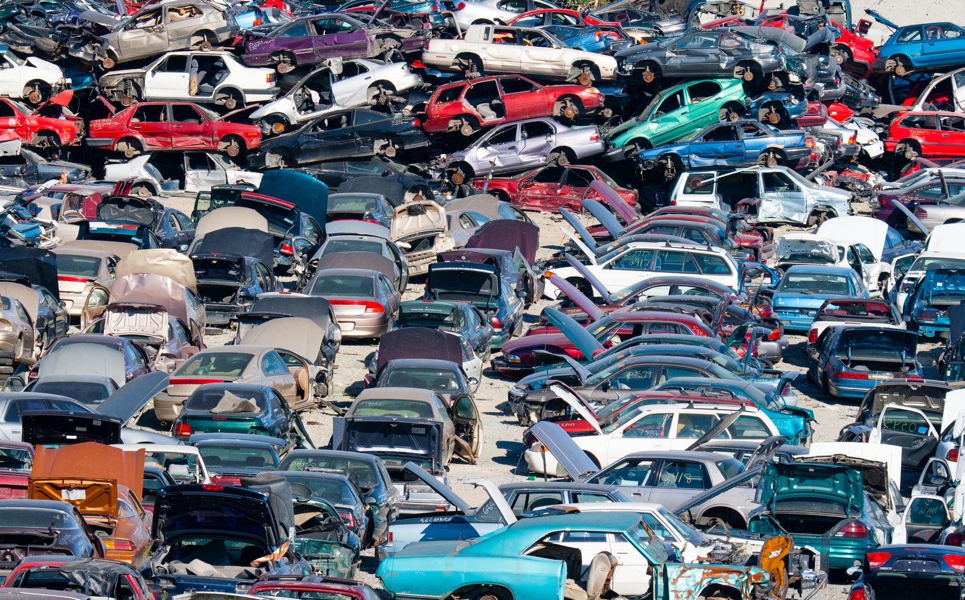 A bunch of cars are stacked on top of each other