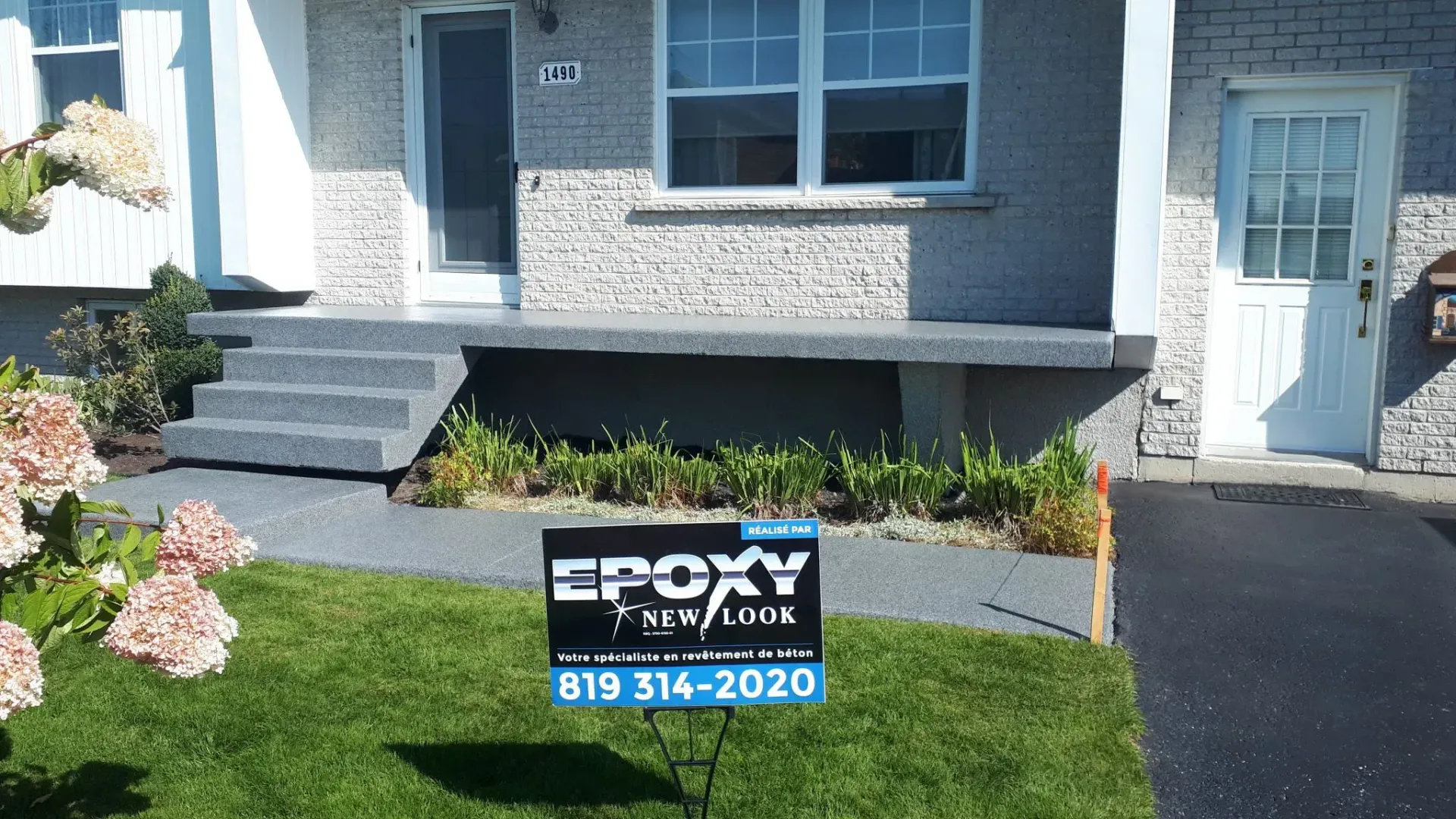 House exterior with newly coated gray porch and steps. 