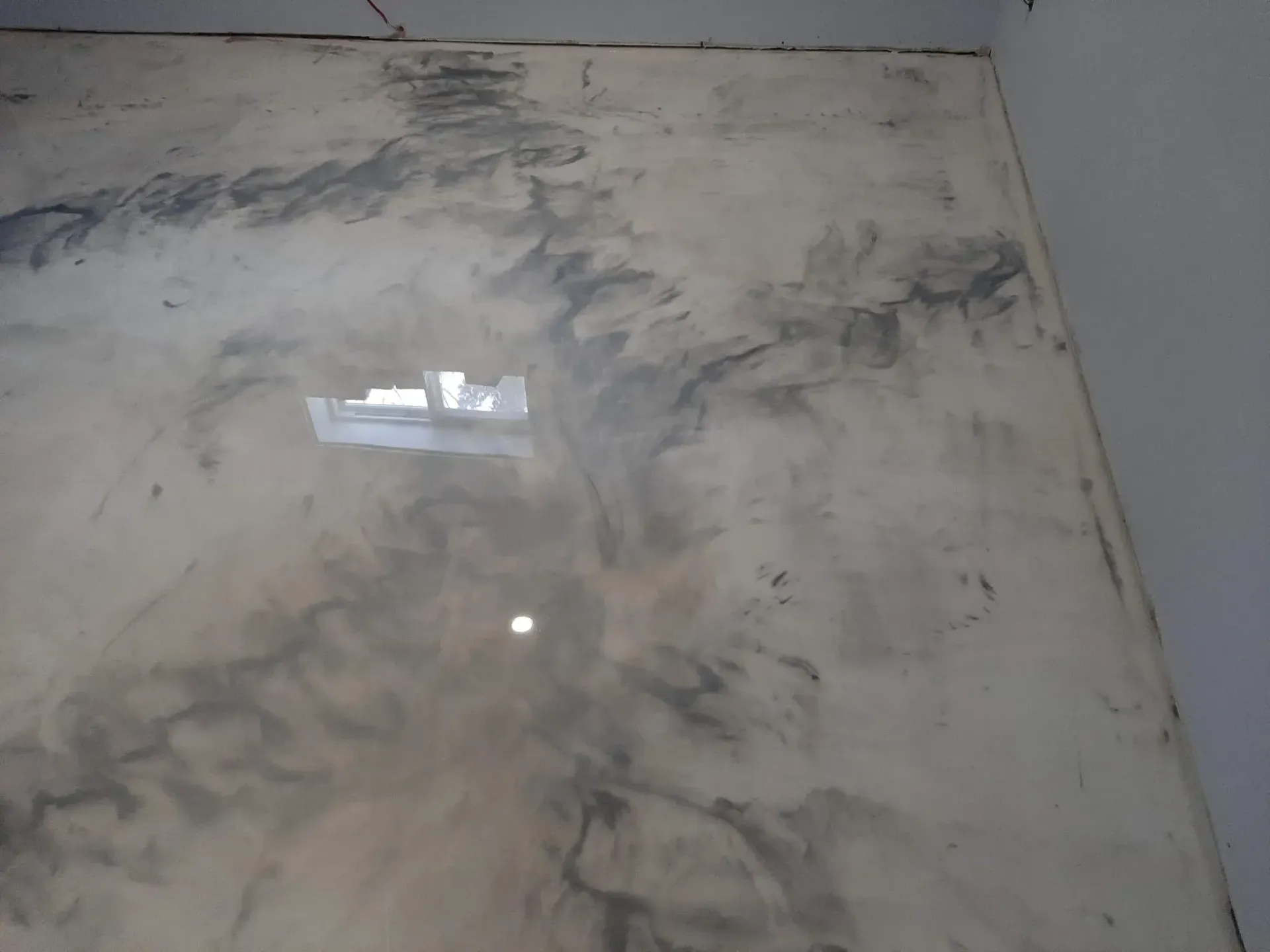 A close up of a marble floor in a room.
